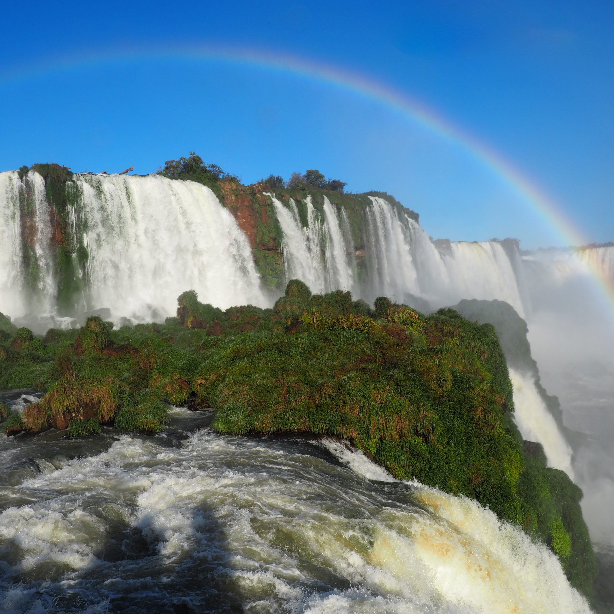 Beautiful scenery of a rainbow over a waterfall in Iguazu National Park, Cataratas, Argentina.