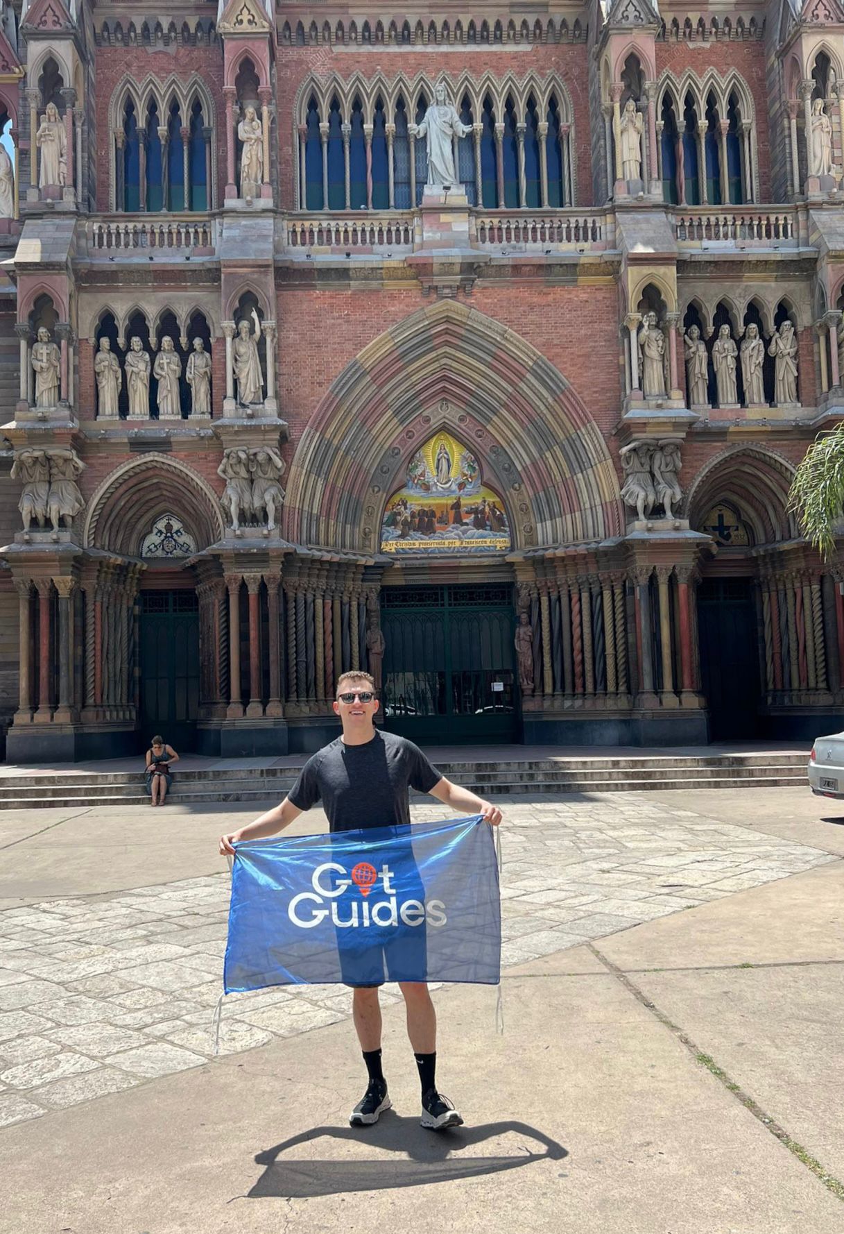 Preston owner of Got Guides with a banner.